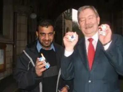 Councillor Taylor - delighted at the smoking ban and a not so delighted Councillor Khalid Mahmood.