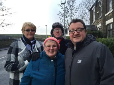 Councillors Andy Kelly and Irene Davidson with local pensioners in Newhey