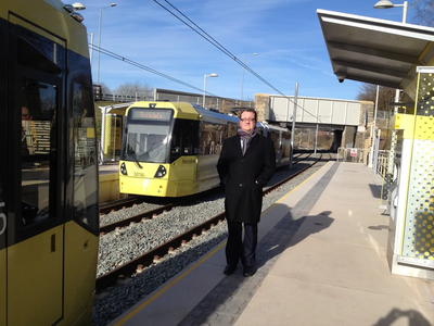 Cllr Andy Kelly with the new trams