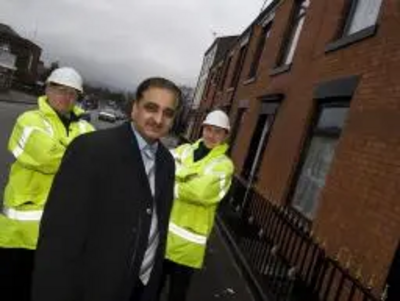 Councillor Ali at the site where the new railings have been fitted