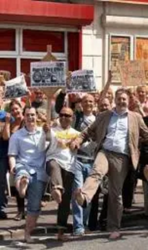 Lib Dem Councillors, activists and members of the public waggle their toes in protest at the closure of Buersil Post Office during a barefoot protest march earlier this month