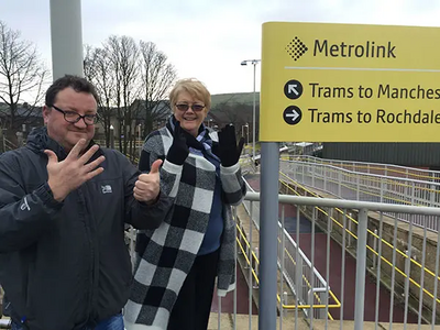 Councillor Andy Kelly and Irene Davidson at Newhey Metrolink Station