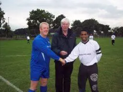 Starting the unique match - Paul Rowen MP tosses the coin with the team captains.