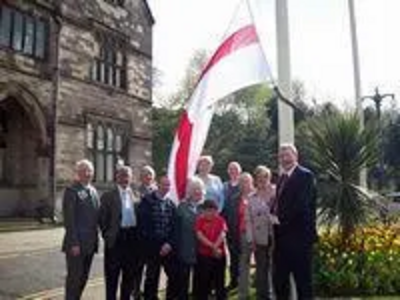 St George flag being raised outside Rochdale Town Hall with the Leader of Rochdale Council, Alan Taylor